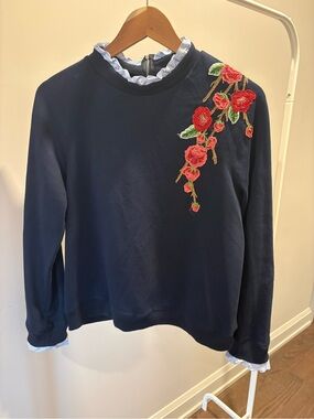 Navy Floral Embroidered Long-Sleeve Top with ruffle accents at neck and sleeves